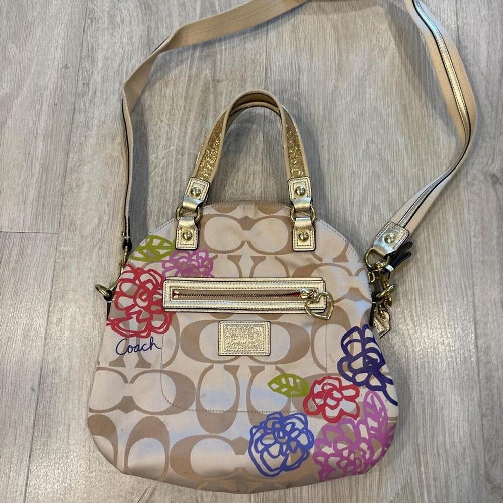 Coach brown purse with flowers.
